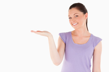 Lovely woman showing a copy space