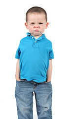 Cute little boy making funny faces on white background