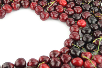 Cherry border in shape of heart on white background
