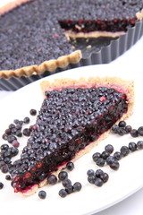 Blackberry Tart: a portion on a plate and in a tart pan