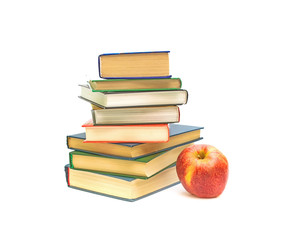 big red apple and books on white background