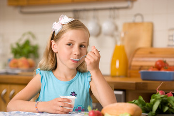 girl eating yoghurt