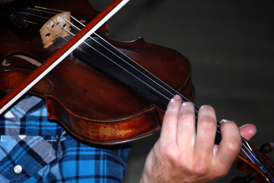 Violinist in a Blue Plaid Shirt.