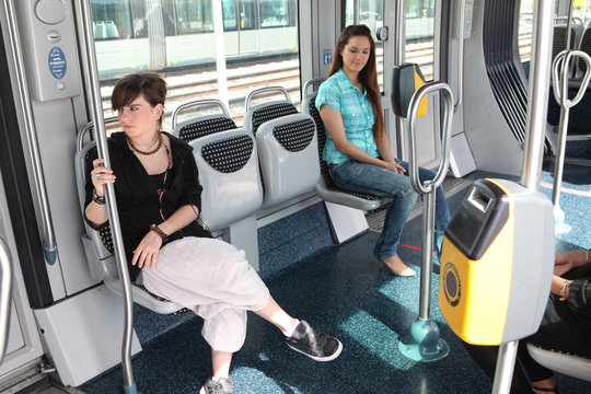 Two girls riding the tram