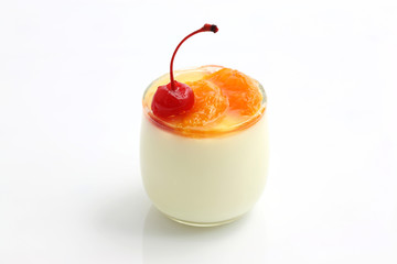 Fruit dessert with cherry and orange isolated in white backgroun