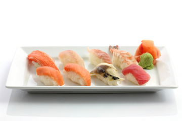 Mix sushi on dish isolated in white background