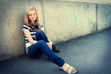 Closeup portrait of depressed teenager girl.