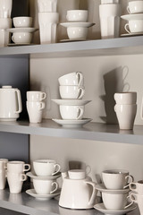Fototapeta na wymiar white cups on the shelf