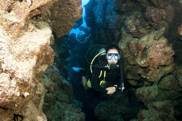 Scuba diver in underwater canyon