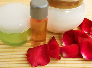 Wellness products and rose petals