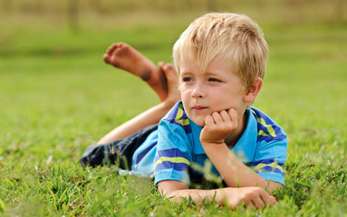 Cute child relaxing outdoors