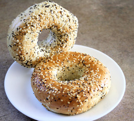 Two wholegrain bagels with poppy seeds & sesame seeds