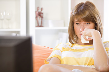 woman watching drama on television