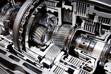 Grey metallic gears bucket in car motor