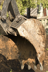 Excavator bucket mechanism