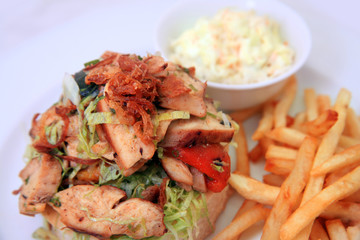 sandwich with meat french fries and coslow