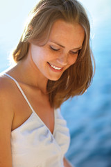 Young woman at the beach on a sunny day