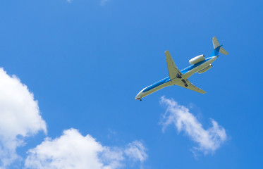 Blue sky, white clouds and airplane.