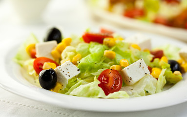 Vegetable salad with goat cheese and olives