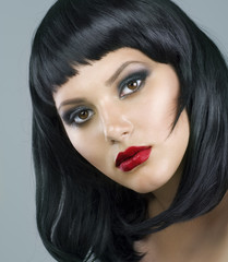 Haircut. Hairstyle. Beautiful Brunette Girl. Luxury Makeup