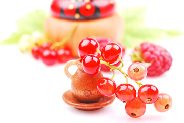 Obraz na płótnie Canvas Blackcurrant and raspberry close-up, wooden bowl