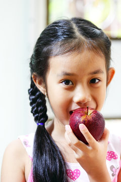 Young girl with apple