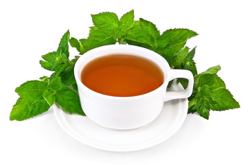 Herbal tea in a white cup with mint
