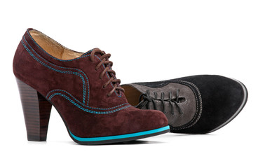 Female high-heeled boots over white