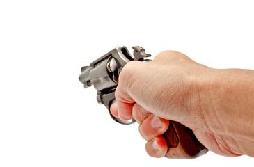 A hand holding a revolver handgun aiming toward