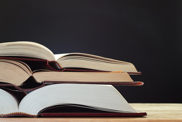Books on Desk with Chalkboard