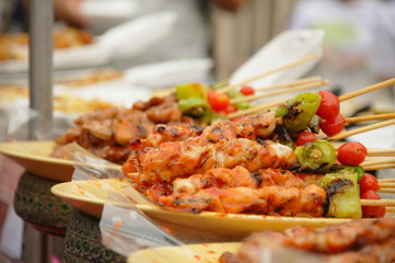 Thai cuisine barbecue chicken and pork skewers