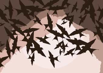 Flying swallow swarm in cave entrance foliage