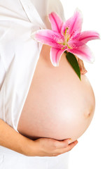 Pregnant woman holding lillies isolated on white