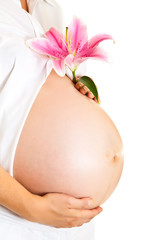 Pregnant woman holding lillies isolated on white