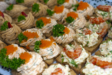 Canapes with caviar and paste