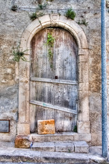 Fototapeta na wymiar an on old gate in Scicli, Sicily