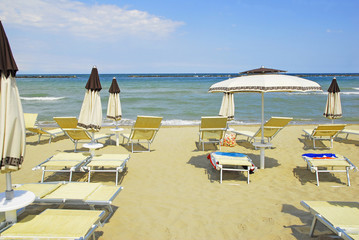 Umbrellas and deckchairs for summer vacations