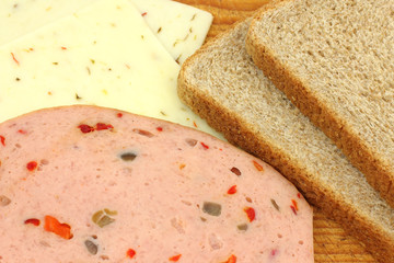 Makings of sandwich with meat cheese bread