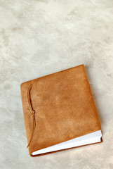 Suede Book on Marbled Background