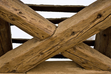 wooden cross in old roof
