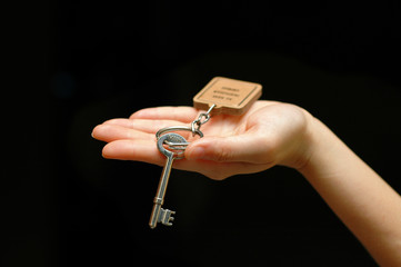 Hand holding a key