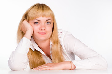 girl sits at table