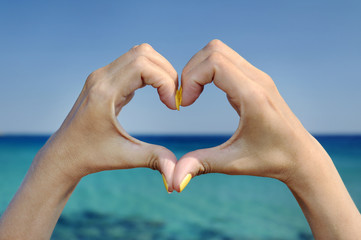 Love sea hand heart gesture