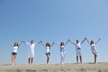 Naklejka premium happy people group have fun and running on beach