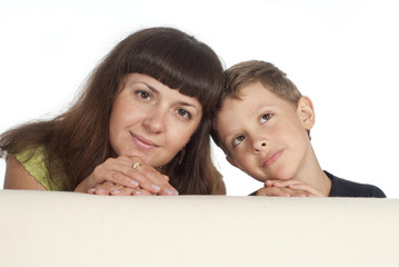 mom and son behind the sofa