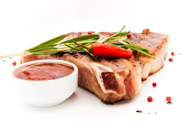 Closeup of grilled steak with pepercorns and rosemary