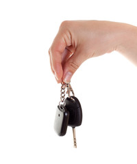 Hand with car keys. Isolated on white.