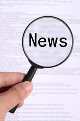 Magnifier glass in hand