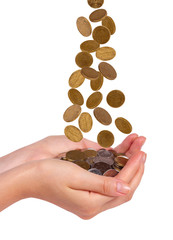 Female hands and falling coins  isolated on white background