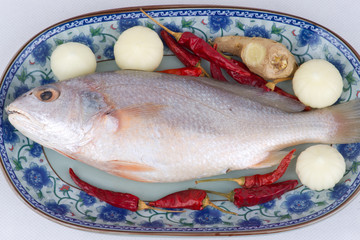Little yellow croaker fish in plate